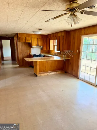 a kitchen with counter top space and appliances