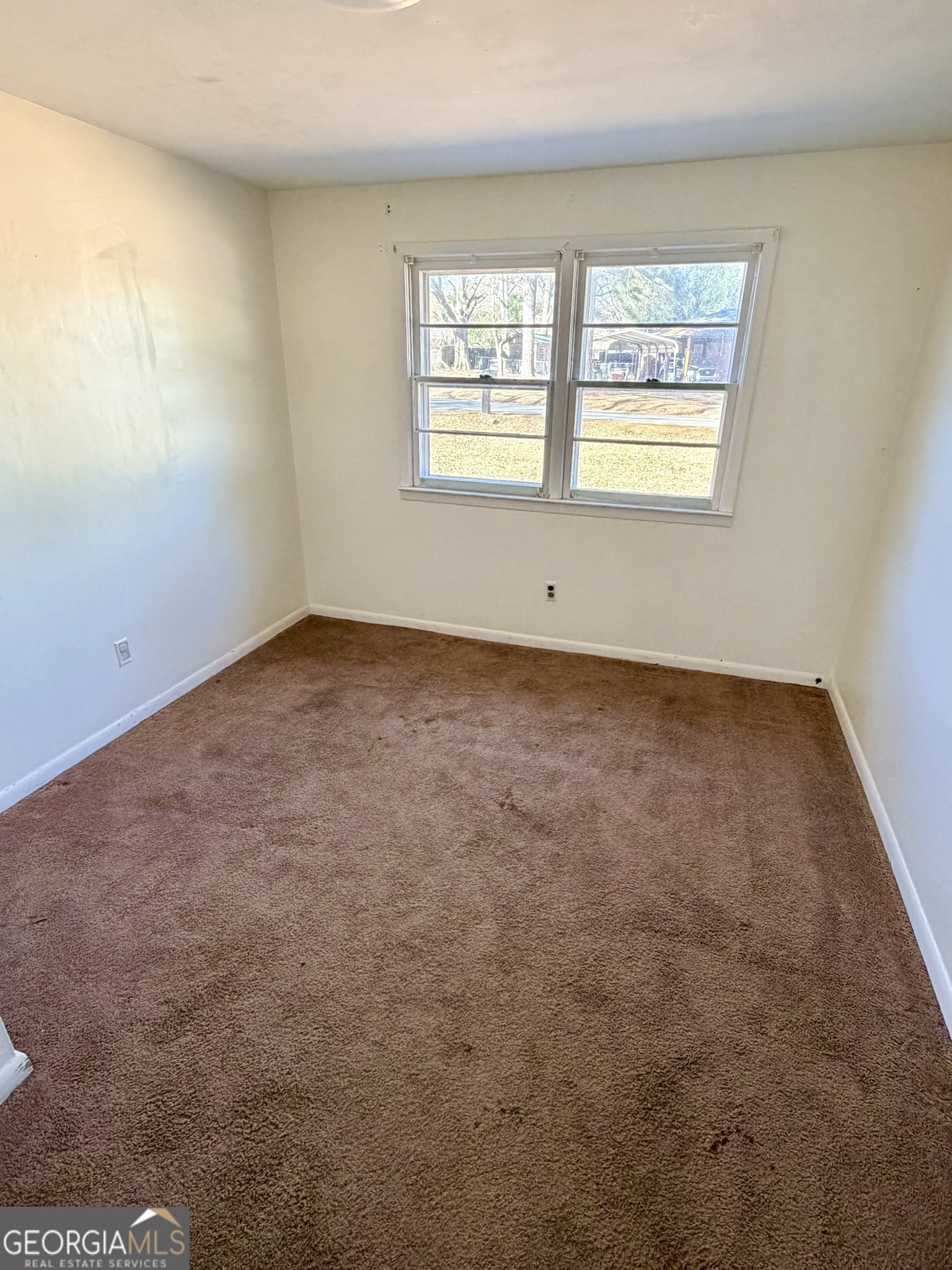 102 Lee Street Centerville, GA 31028 - Photo 10 of 30 an empty room with windows