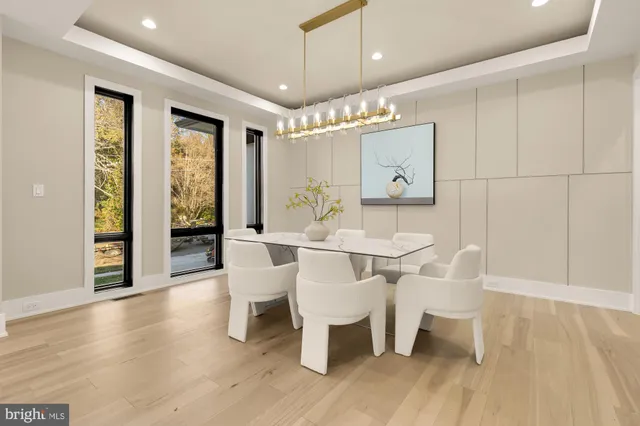 a kitchen with granite countertop white cabinets and stainless steel appliances