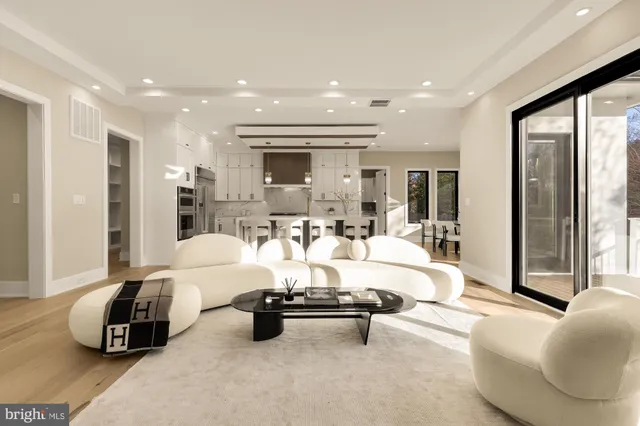 a kitchen with stainless steel appliances sink stove and cabinets
