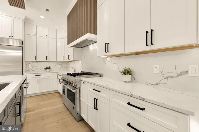 a bedroom with a large bed and a large window