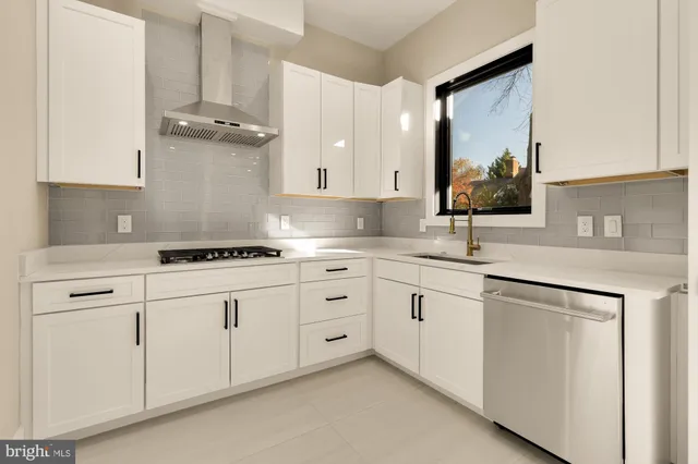 a bathroom with a sink toilet vanity and shower