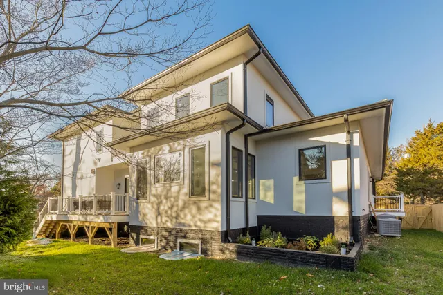 a bathroom with a sink toilet vanity and shower