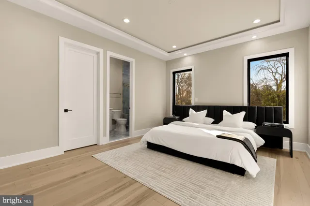 a view of kitchen with stainless steel appliances dining table chairs and wooden floor