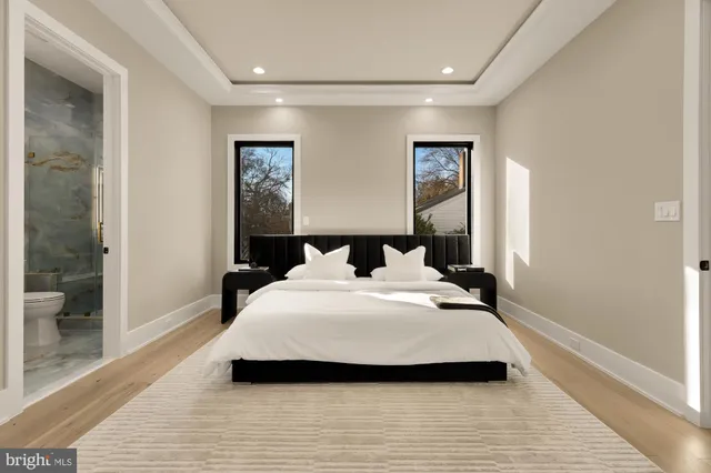 a kitchen with stainless steel appliances granite countertop a refrigerator a sink and a microwave