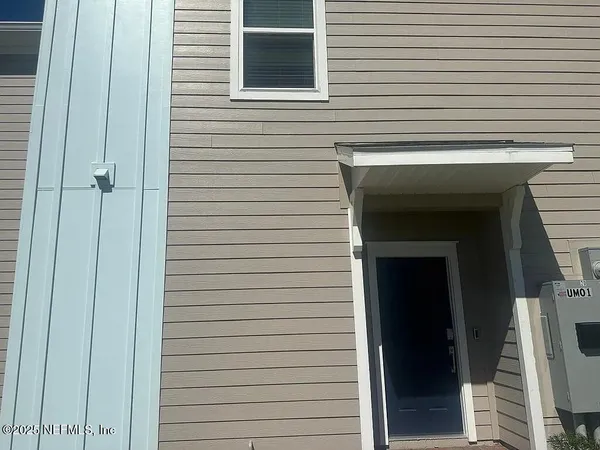 a view of a utility room with a door