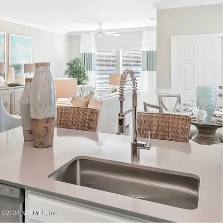 a kitchen with a faucet a sink and a counter top space