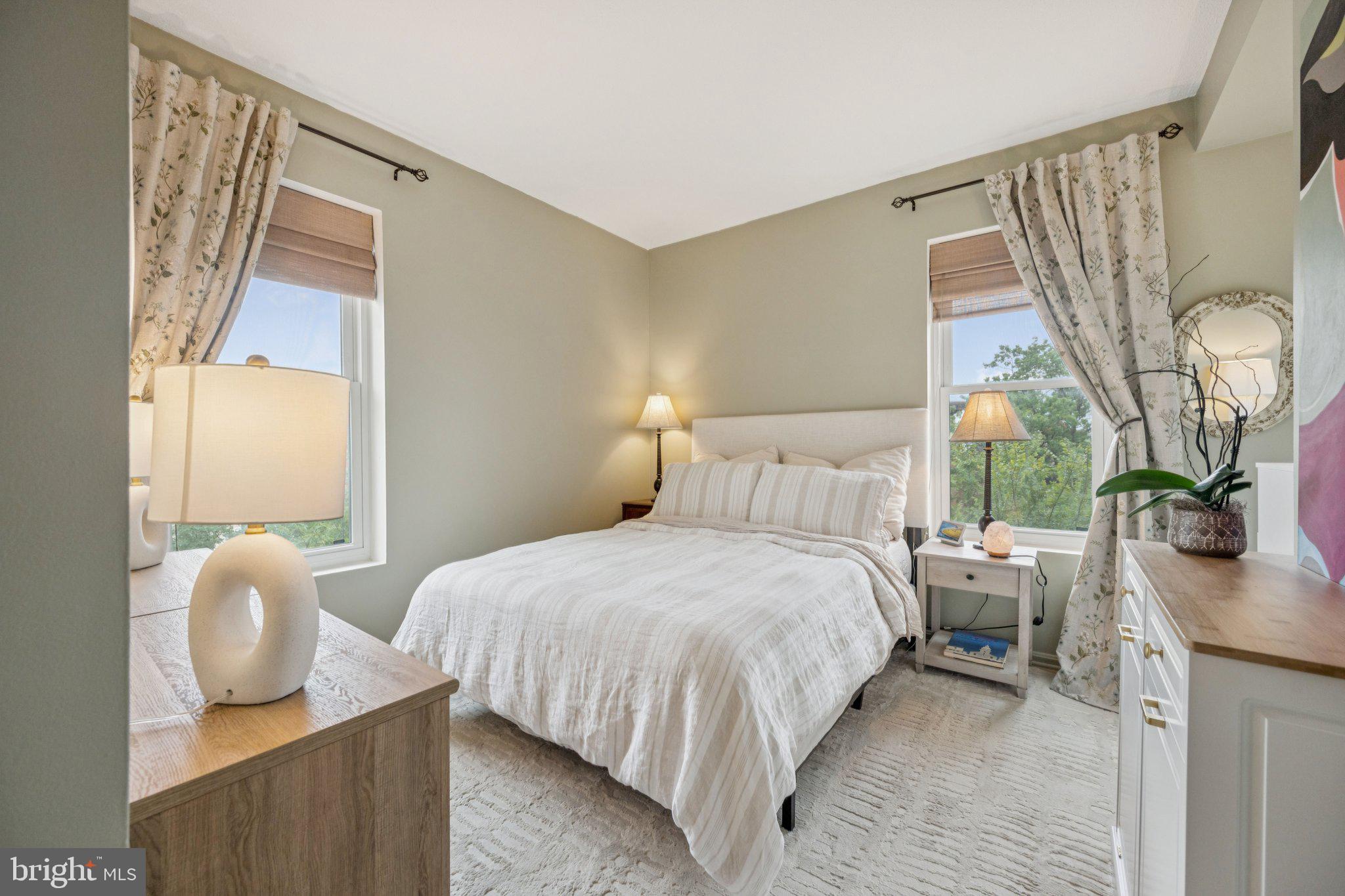 1812 Vernon Street Northwest, Unit 34 Washington, DC 20009 - Photo 14 of 26 a bedroom with a bed and a large window