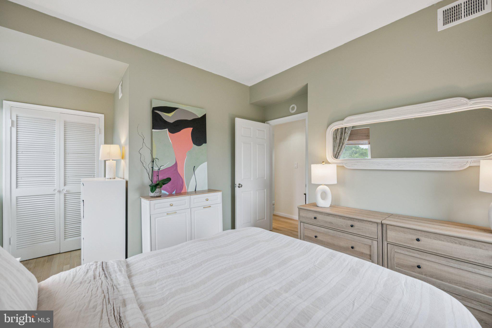 1812 Vernon Street Northwest, Unit 34 Washington, DC 20009 - Photo 16 of 26 a bedroom with a bed and a cabinets