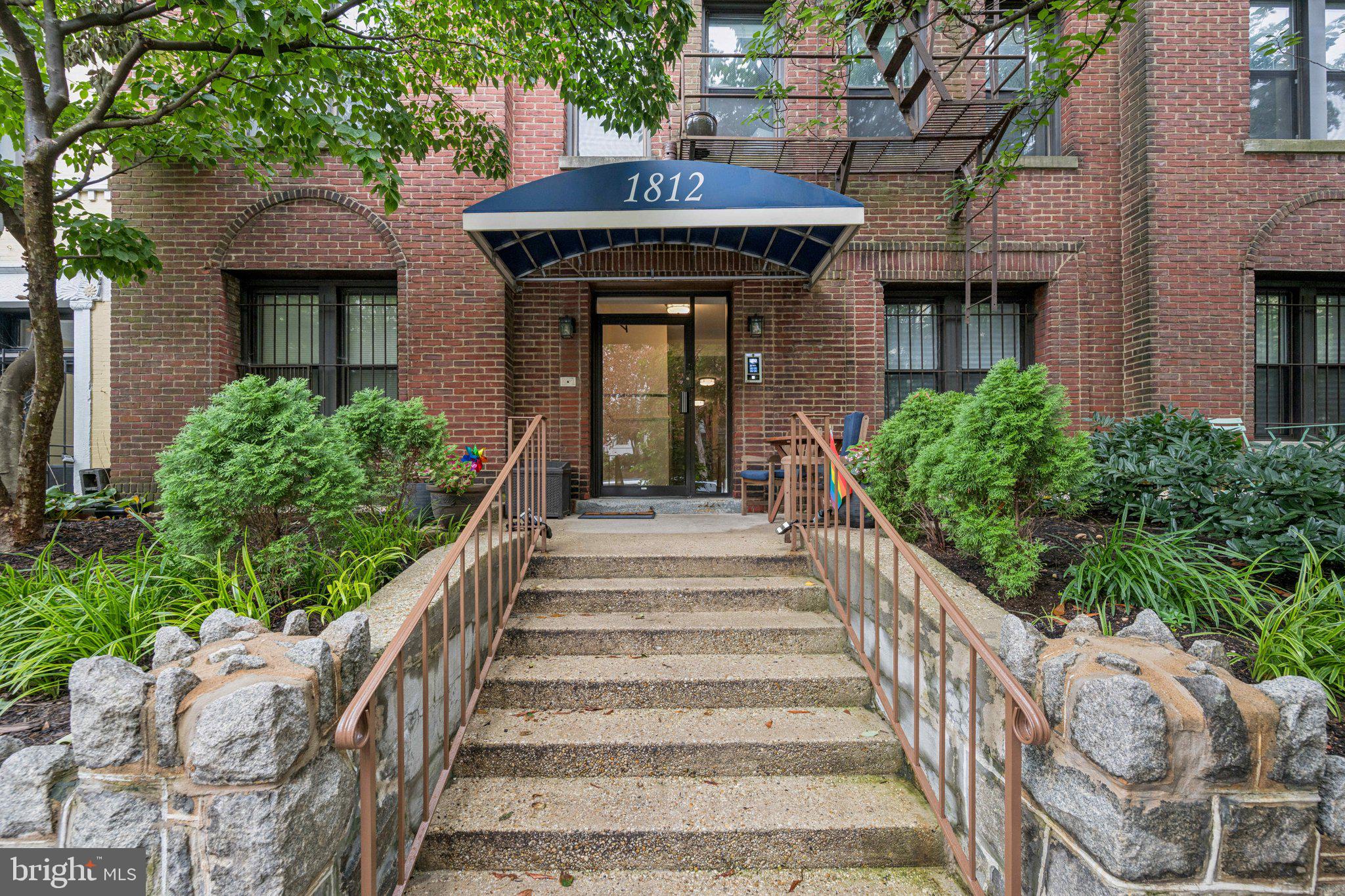 1812 Vernon Street Northwest, Unit 34 Washington, DC 20009 - Photo 3 of 26 a view of a house with large windows and plants