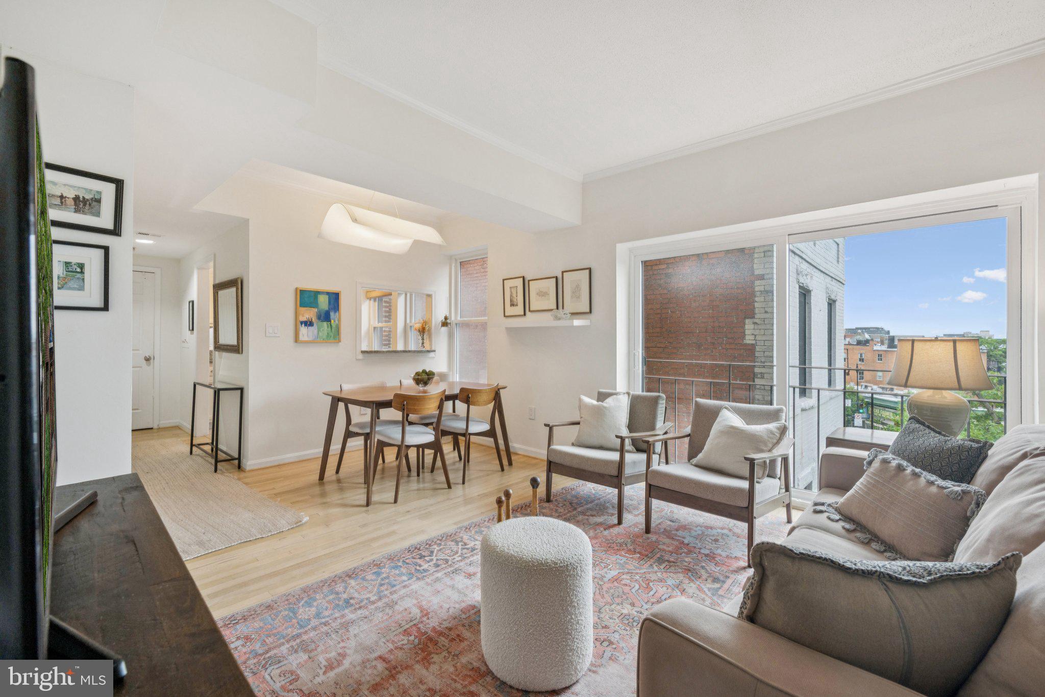 1812 Vernon Street Northwest, Unit 34 Washington, DC 20009 - Photo 25 of 26 a living room with furniture and a large window