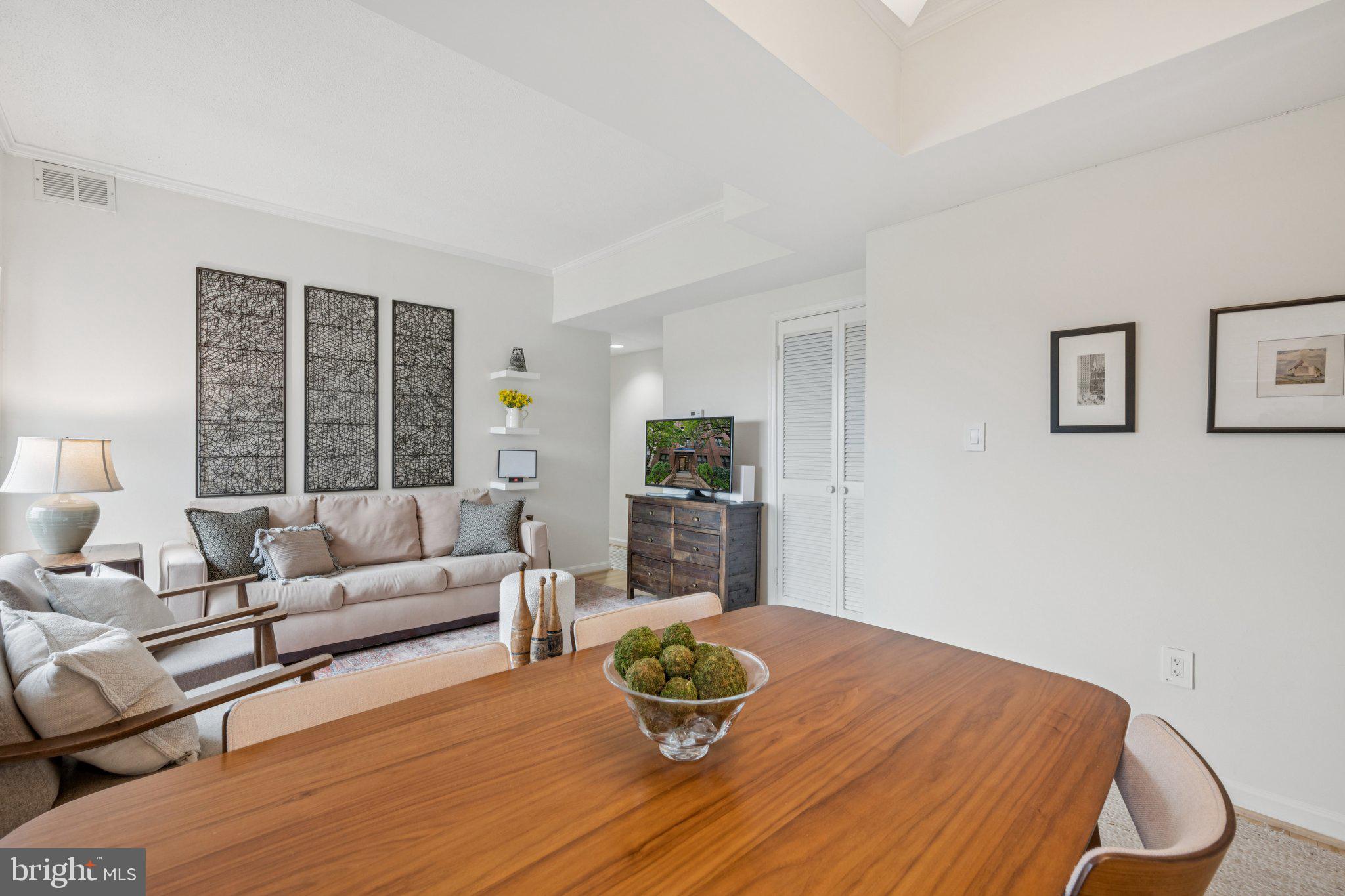 1812 Vernon Street Northwest, Unit 34 Washington, DC 20009 - Photo 7 of 26 a living room with furniture and a large window