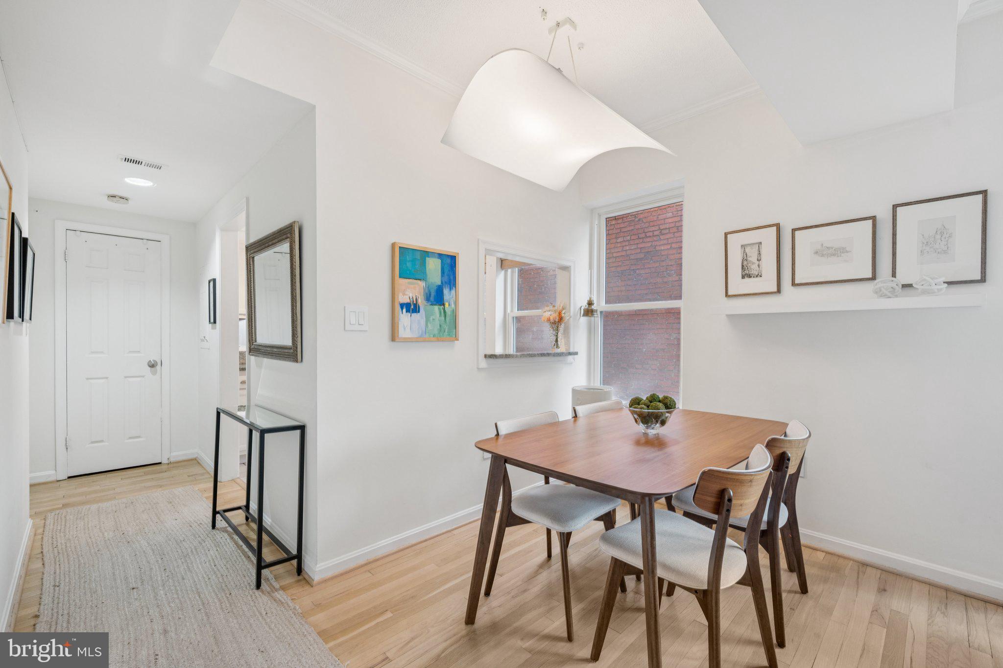 1812 Vernon Street Northwest, Unit 34 Washington, DC 20009 - Photo 8 of 26 a view of a dining room with furniture and wooden floor