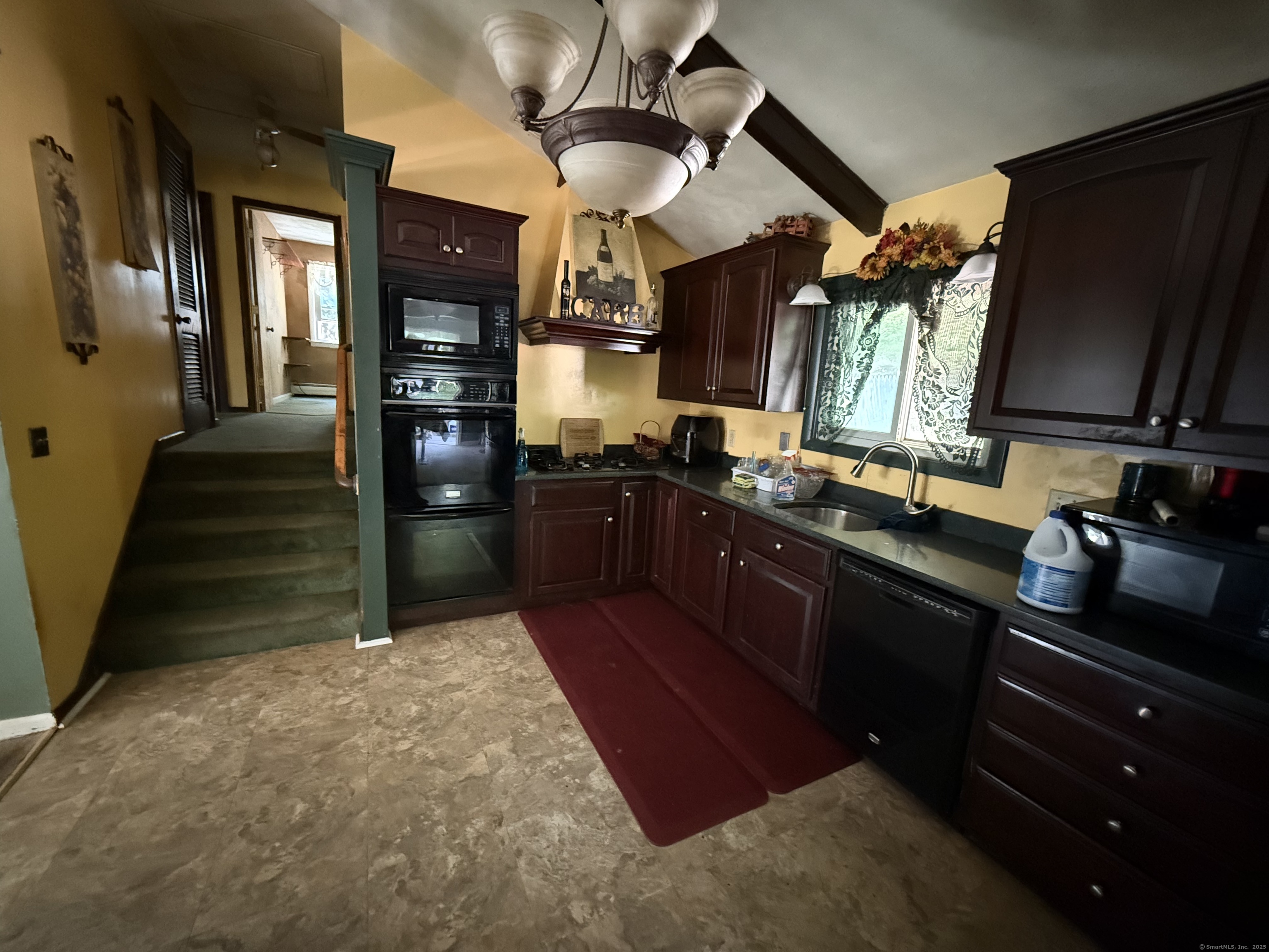 9 Deerbrook Road Norwich, CT 06360 - Photo 4 of 10 a kitchen with stainless steel appliances granite countertop a sink stove and refrigerator