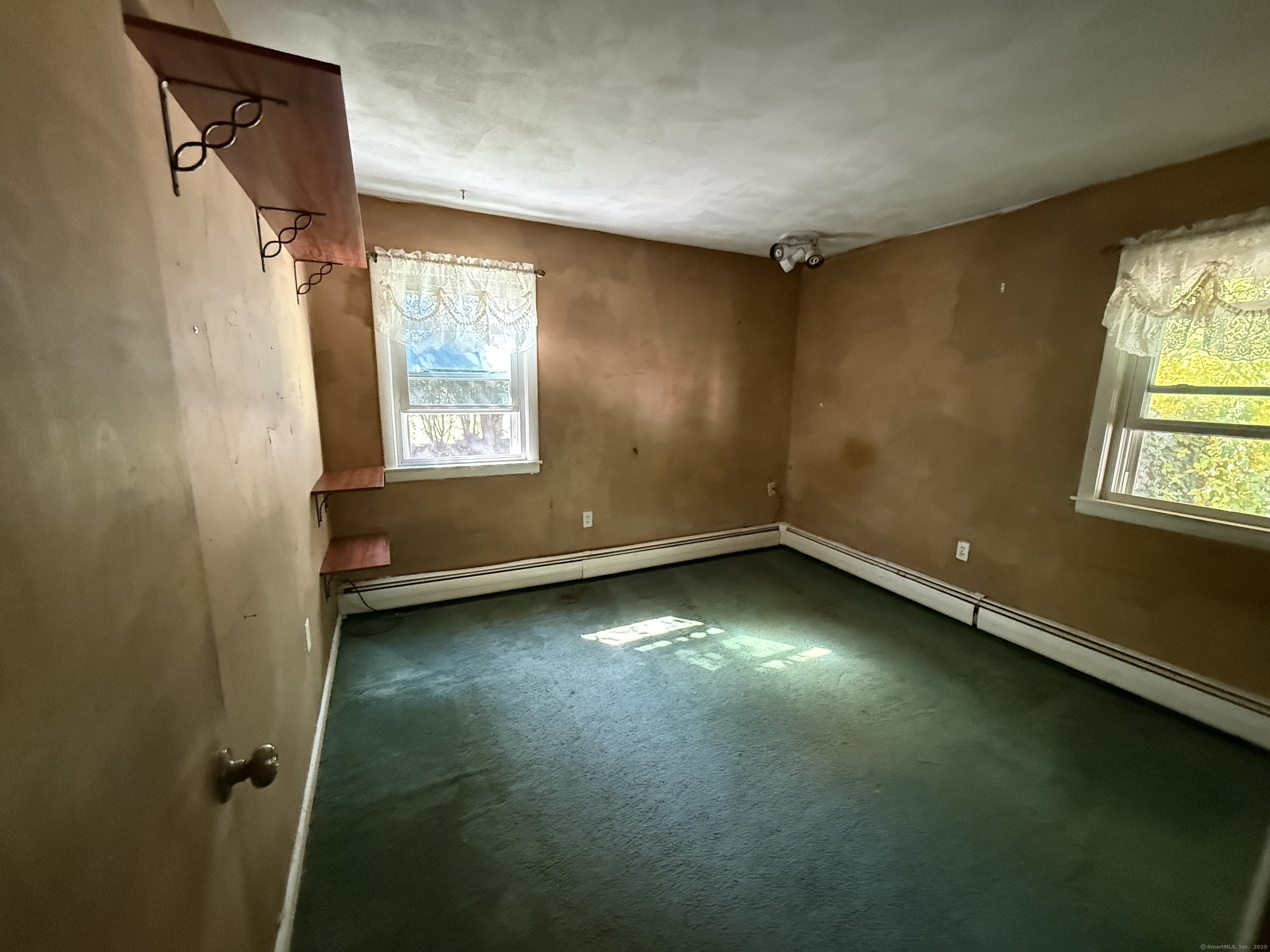 9 Deerbrook Road Norwich, CT 06360 - Photo 6 of 10 an empty room with a window