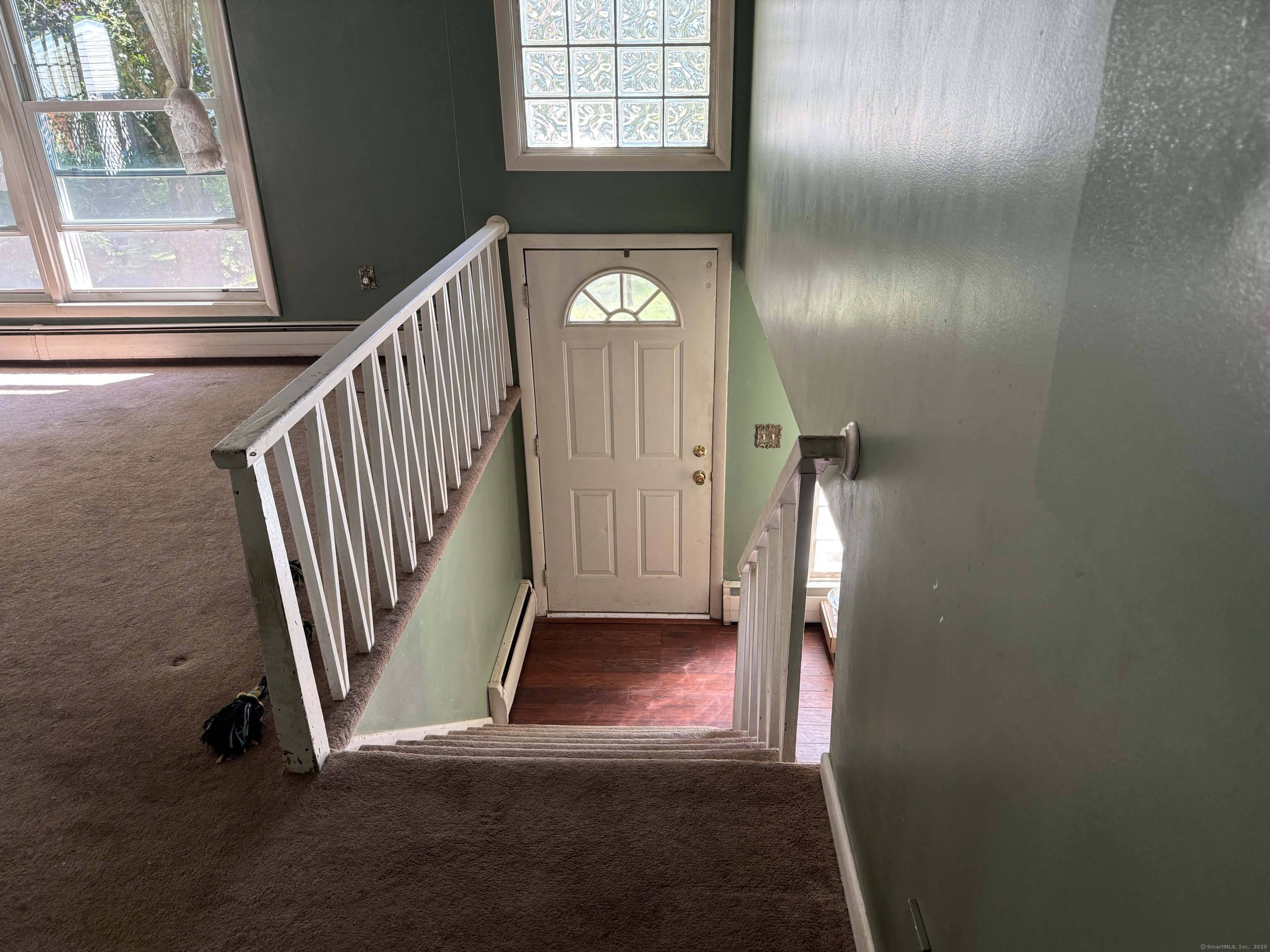 9 Deerbrook Road Norwich, CT 06360 - Photo 10 of 10 a view of an entryway with wooden floor