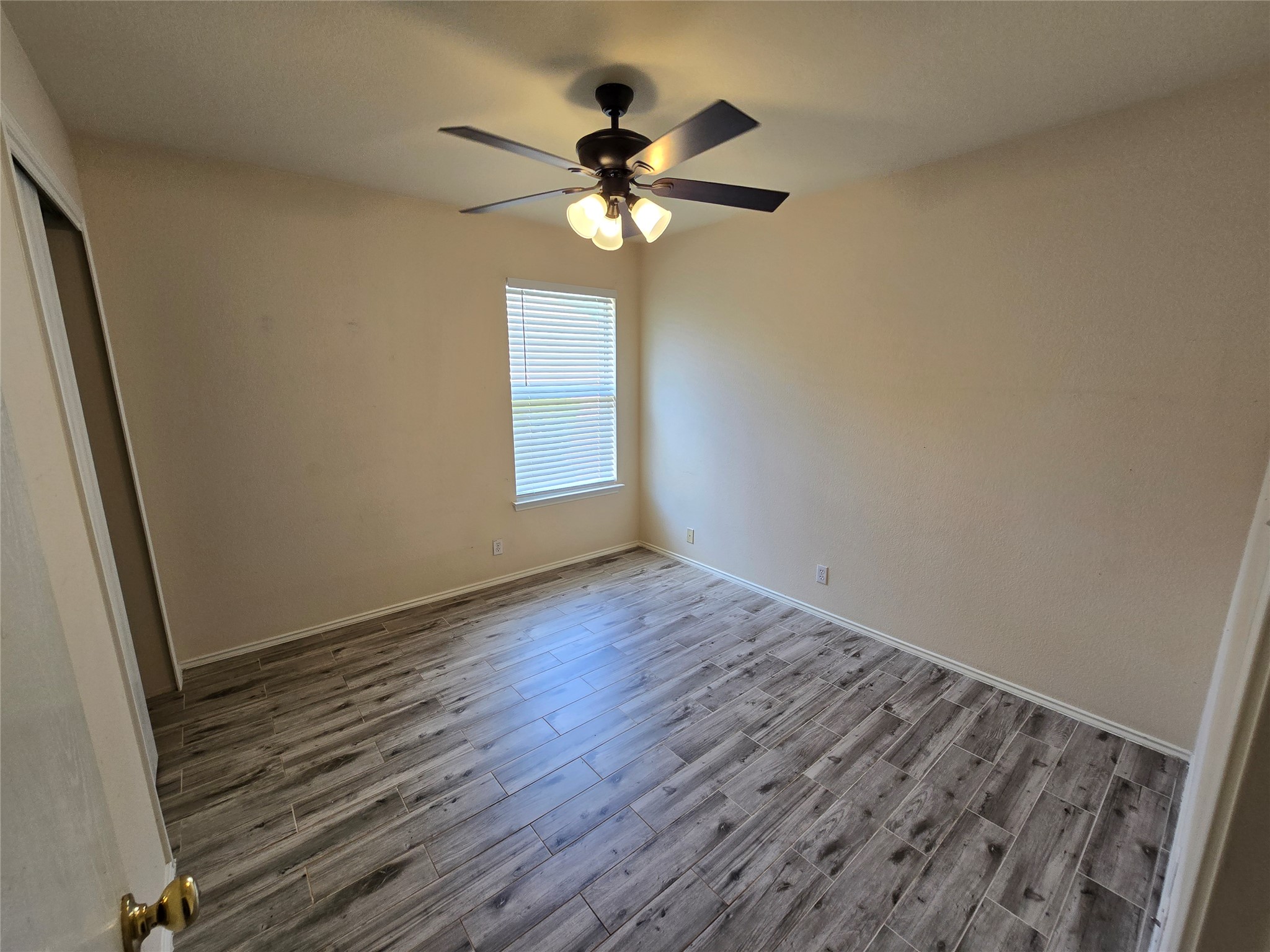 2011 Garrison Drive Leander, TX 78641 - Photo 17 of 23 Bedroom two on the right side of the home with a ceiling fan and closet