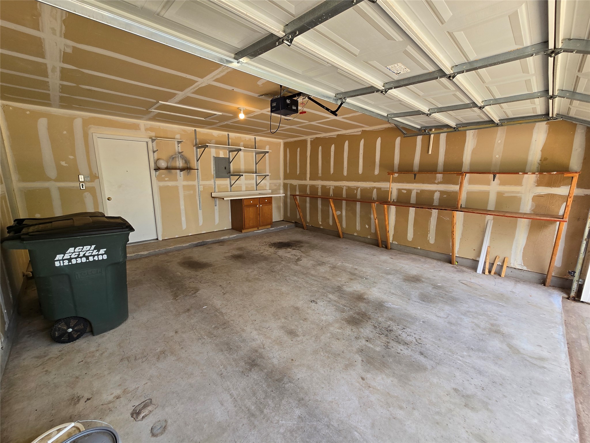 2011 Garrison Drive Leander, TX 78641 - Photo 20 of 23 2-car garage, storage shelves, and attic space for storage