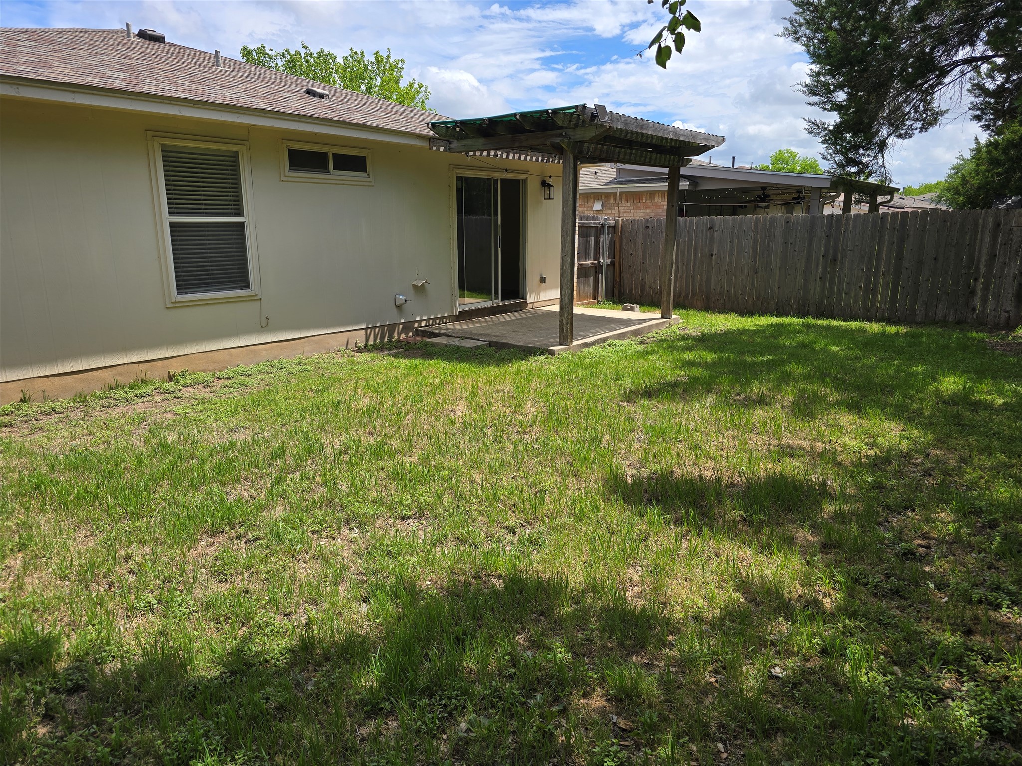 2011 Garrison Drive Leander, TX 78641 - Photo 23 of 23 Fenced backyard with a patio area and a pergola