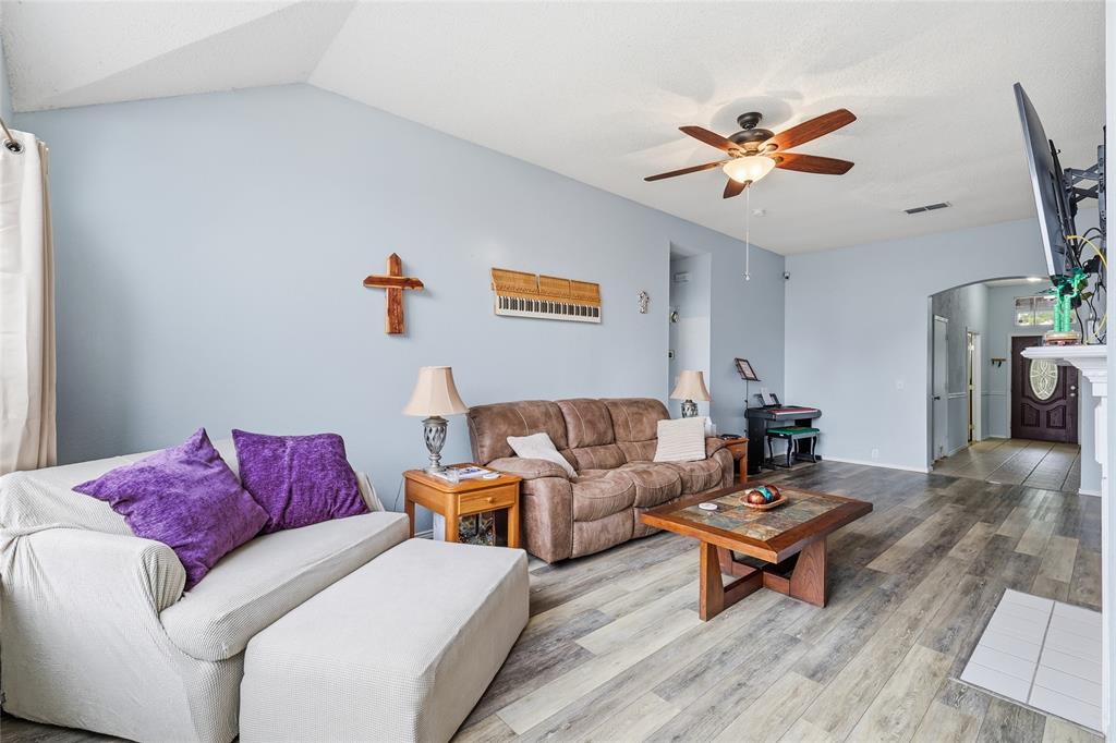 763 Winding Oak Bend Lake Dallas, TX 75065 - Photo 16 of 25 a living room with furniture and a wooden floor