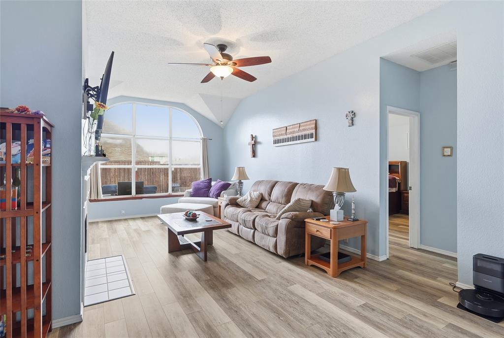 763 Winding Oak Bend Lake Dallas, TX 75065 - Photo 17 of 25 a living room with furniture and a large window