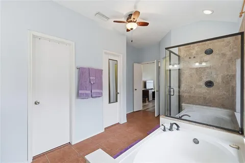 a bathroom with a tub sink and shower