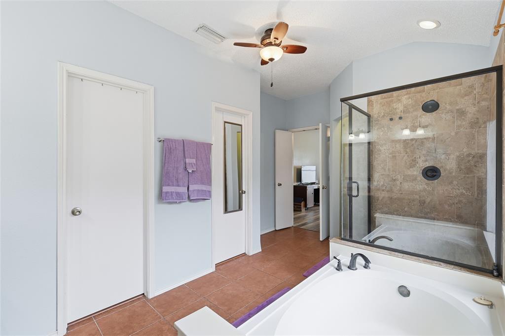 763 Winding Oak Bend Lake Dallas, TX 75065 - Photo 21 of 25 a bathroom with a tub sink and shower