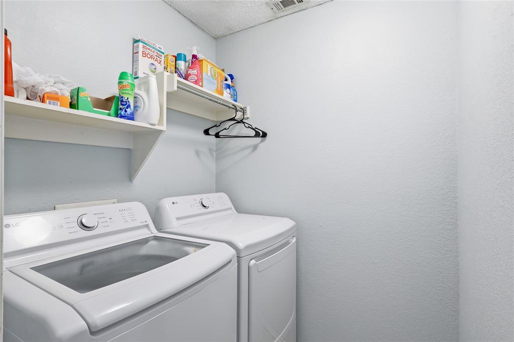 763 Winding Oak Bend Lake Dallas, TX 75065 - Photo 22 of 25 a utility room with dryer and washer