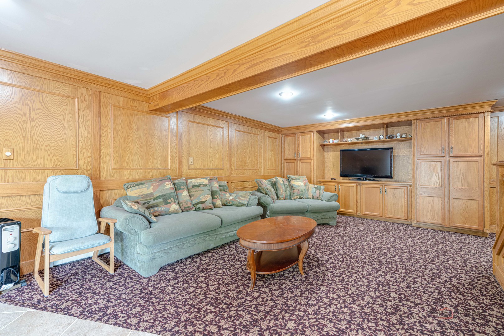 357 Roberts Road Inverness, IL 60010 - Photo 36 of 50 a living room with furniture and a flat screen tv