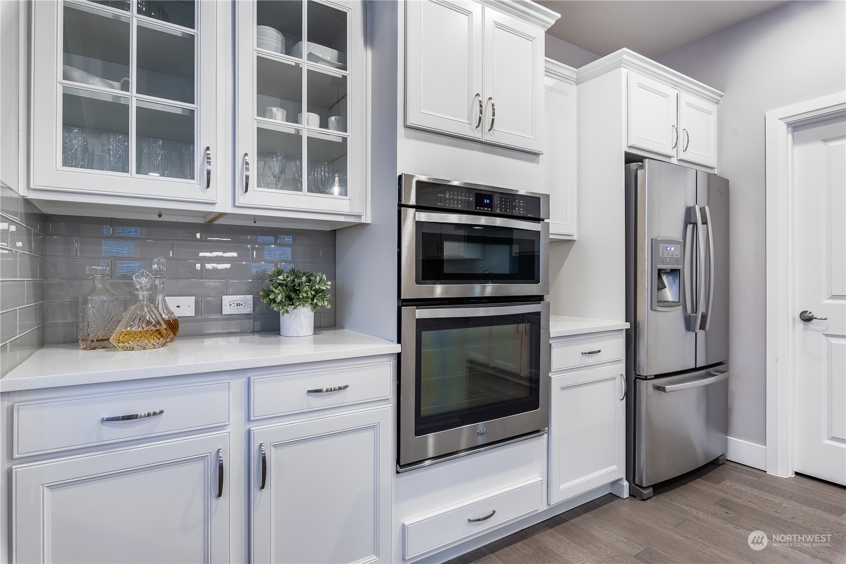 4105 Strumme Road Bothell, WA 98012 - Photo 11 of 40 a kitchen with stainless steel appliances a refrigerator a stove a microwave and cabinets