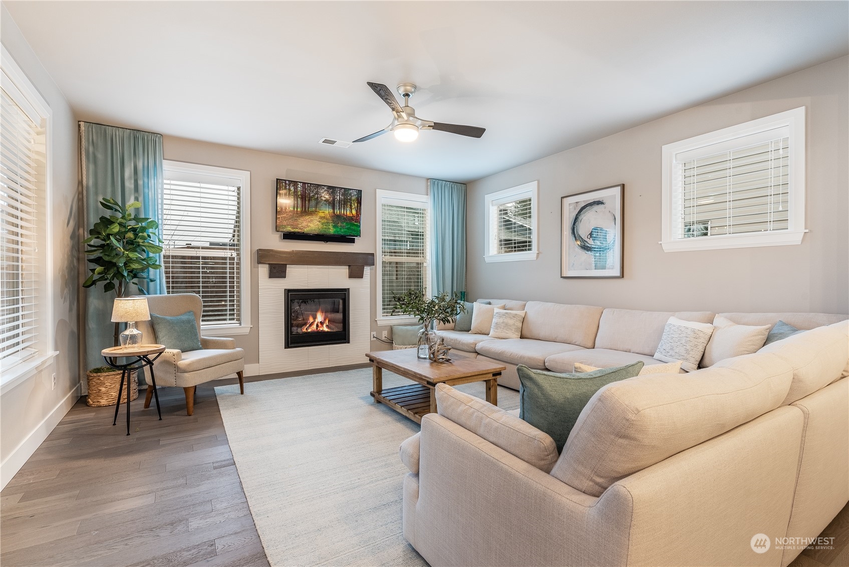4105 Strumme Road Bothell, WA 98012 - Photo 13 of 40 a living room with furniture fireplace and a large window