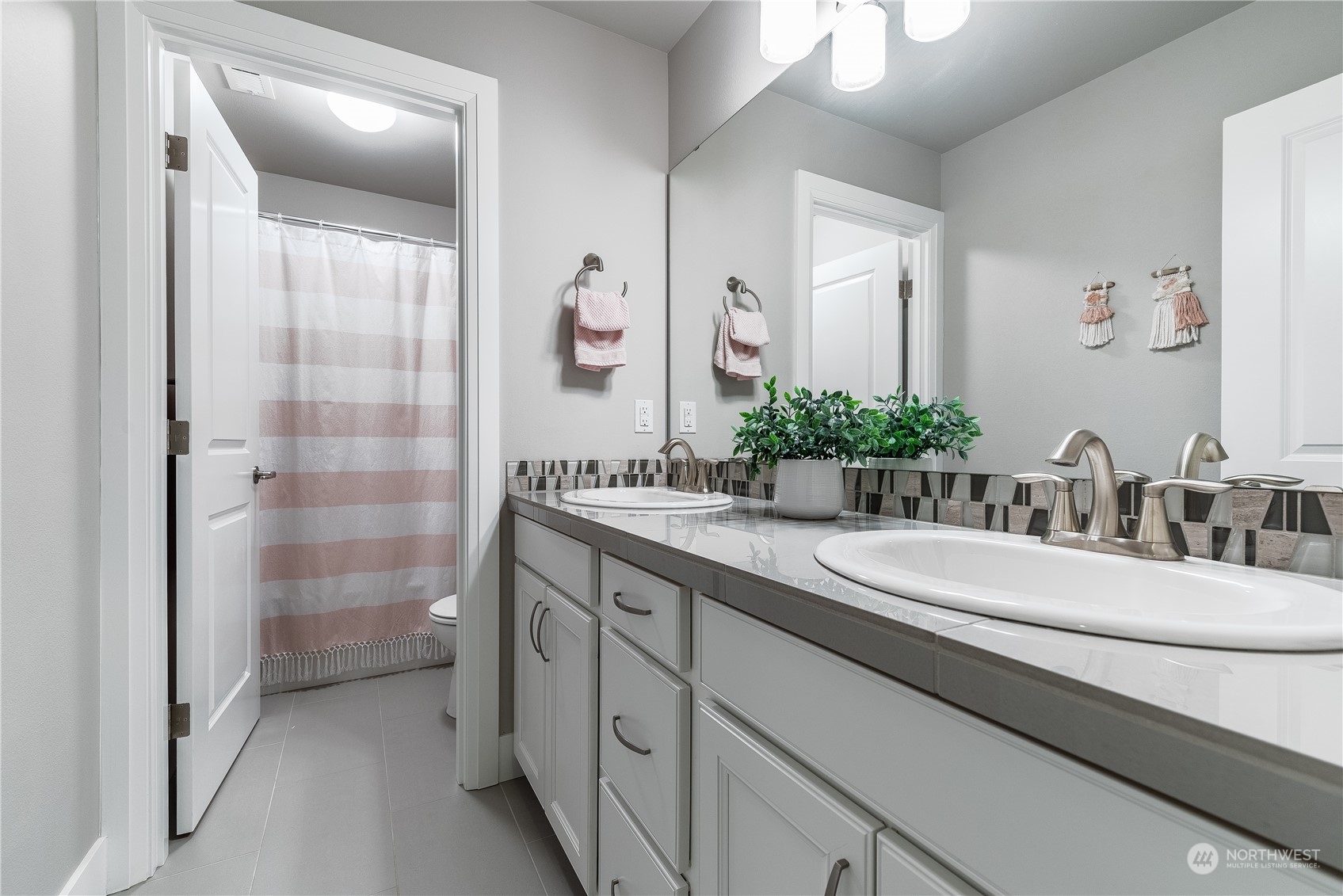 4105 Strumme Road Bothell, WA 98012 - Photo 21 of 40 a bathroom with a double vanity sink mirror and shower