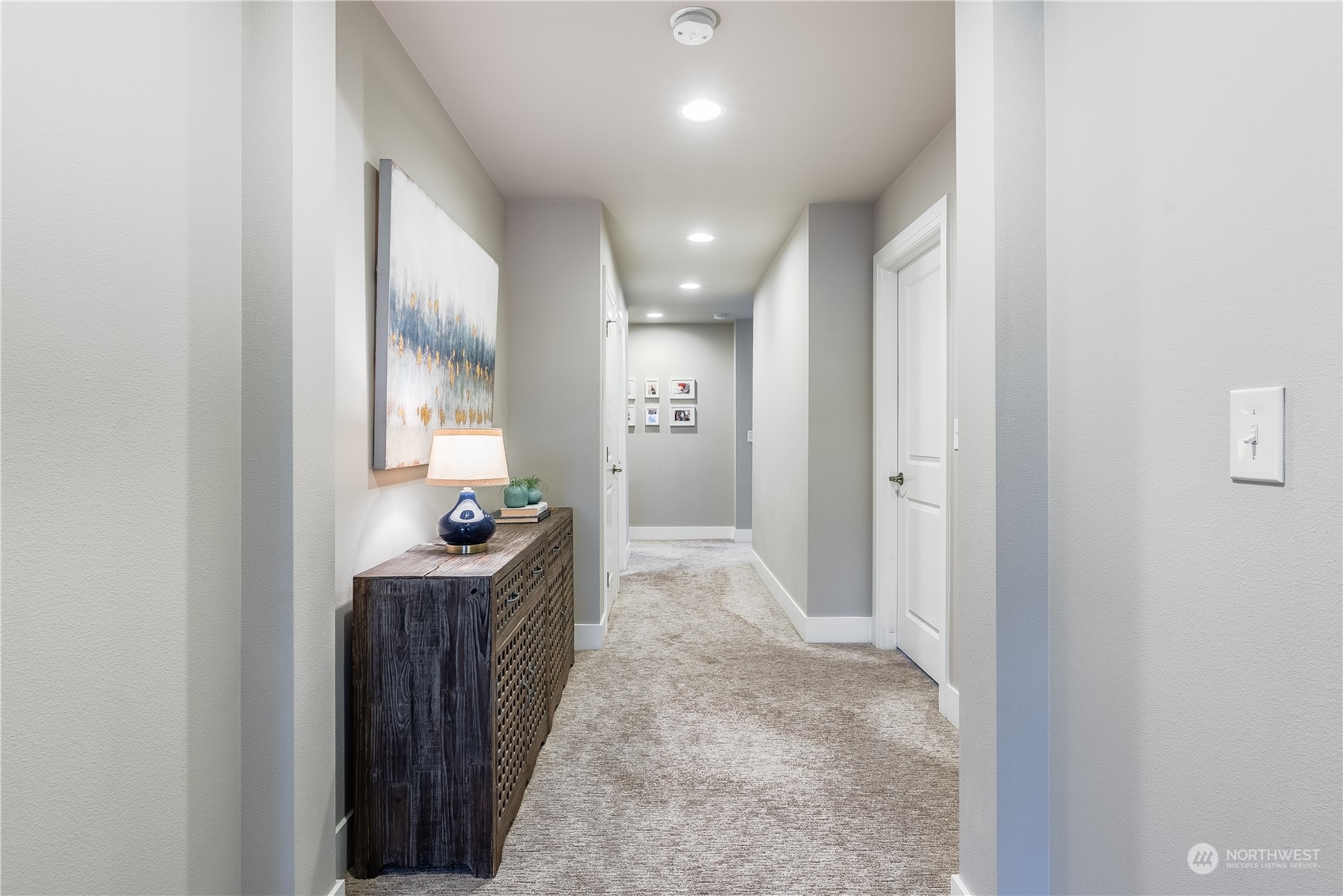 4105 Strumme Road Bothell, WA 98012 - Photo 24 of 40 a view of a hallway to a livingroom and a bathroom