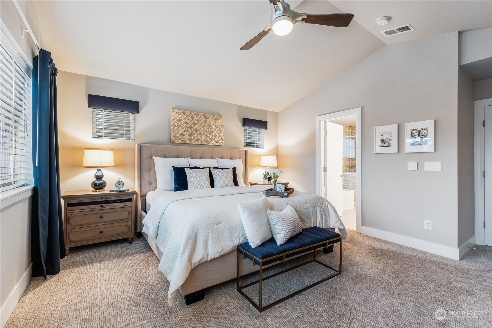 4105 Strumme Road Bothell, WA 98012 - Photo 27 of 40 a bedroom with a bed and a chandelier
