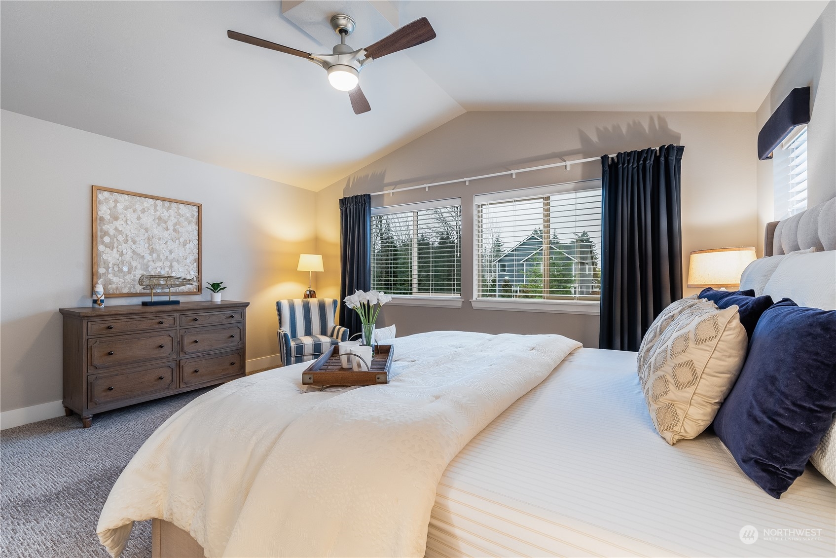 4105 Strumme Road Bothell, WA 98012 - Photo 29 of 40 a bedroom with a bed a large window closet and flat screen tv