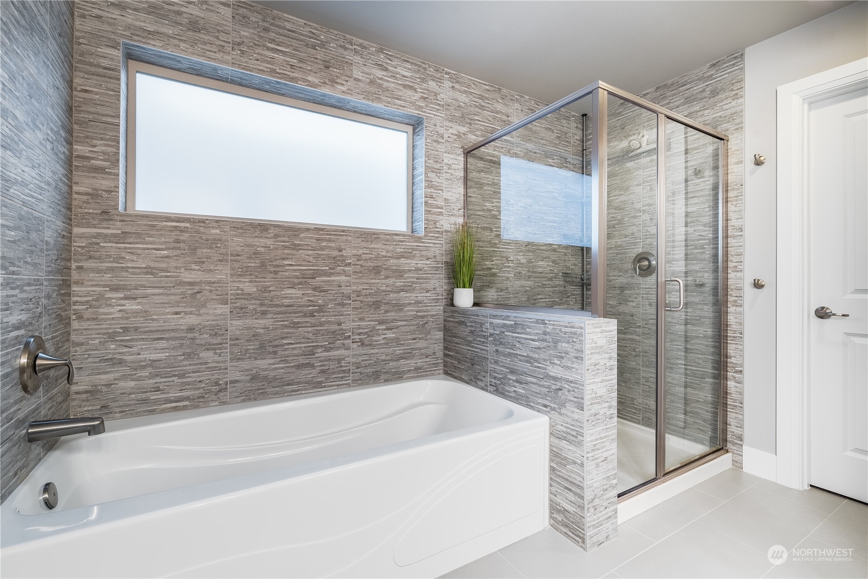 4105 Strumme Road Bothell, WA 98012 - Photo 32 of 40 a bathroom with a bathtub and a shower