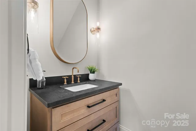 a bedroom with a bed and glass window