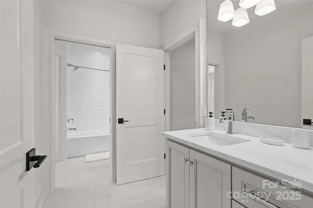 a living room with furniture rug and a table