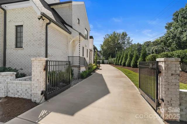 a view of an house with swimming pool yard and patio