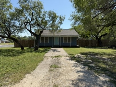603 West Avenue F Avenue Kingsville, TX 78363 - Photo 1 of 5 a front view of a house with a yard