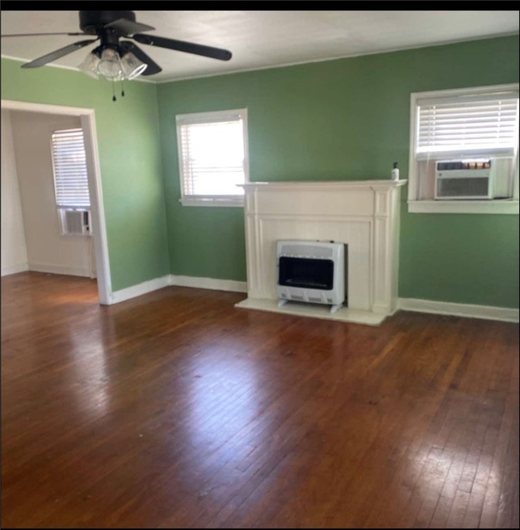 603 West Avenue F Avenue Kingsville, TX 78363 - Photo 5 of 5 a view of empty room with fireplace and wooden floor