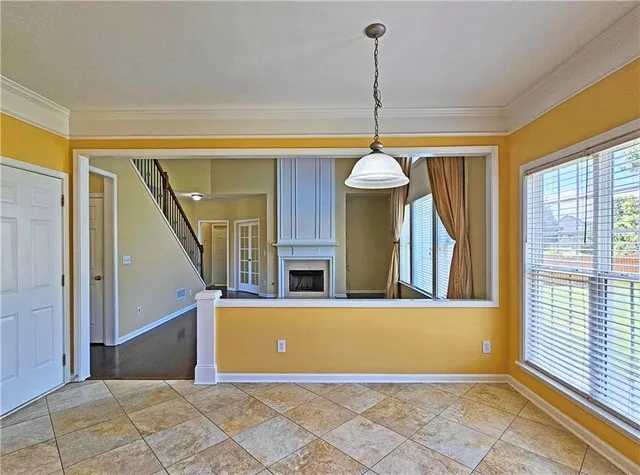 a view of a hallway with windows