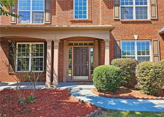 a view of a brick building with a large windows