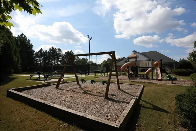 a view of a park with large trees