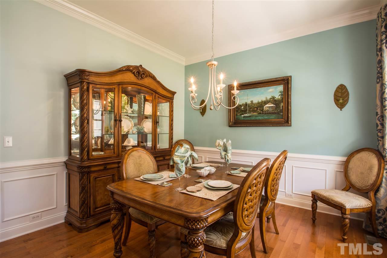 10125 Darling Street Raleigh, NC 27613 - Photo 14 of 25 a view of a dining room with furniture and wooden floor