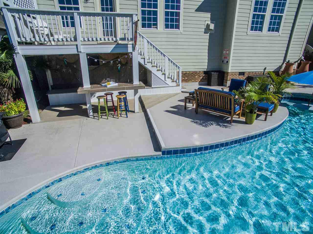 10125 Darling Street Raleigh, NC 27613 - Photo 6 of 25 a view of a house with backyard and sitting area