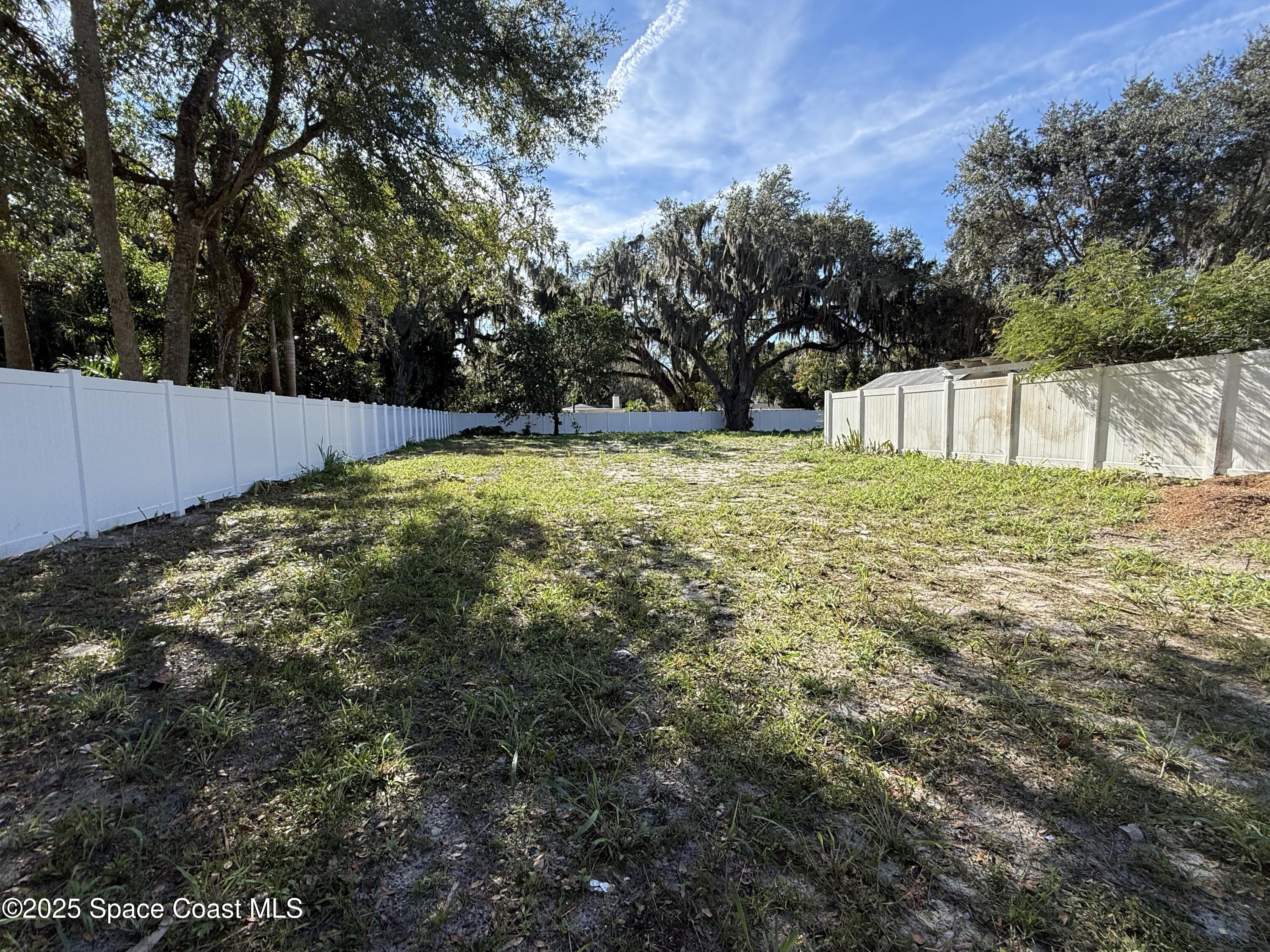 a view of backyard with green space