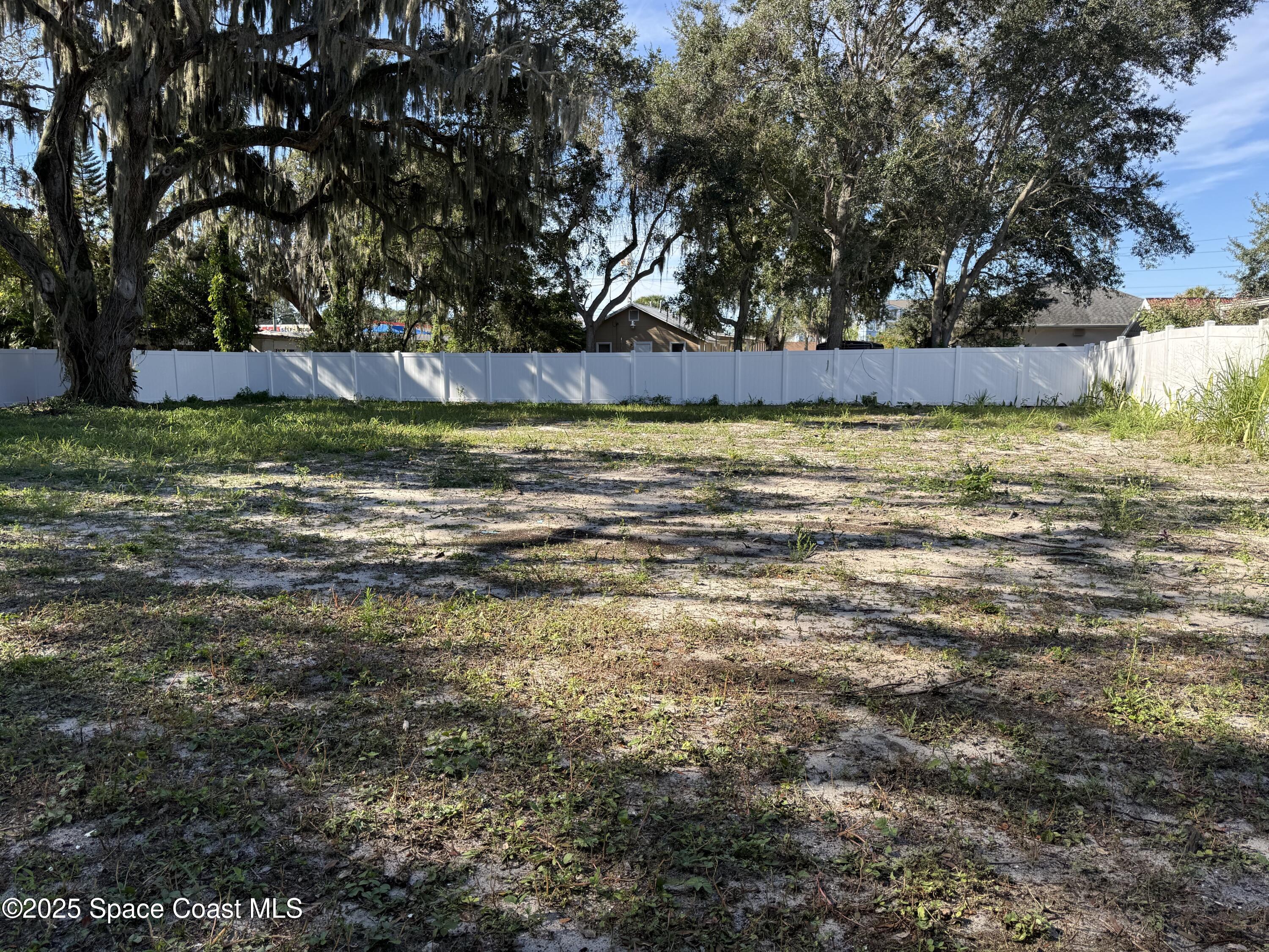 213 Sweet Street Rockledge, FL 32955 - Photo 9 of 24 a view of a yard with large trees