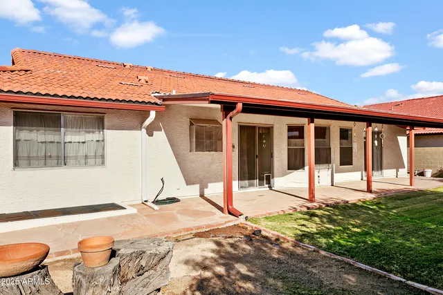 a house with swimming pool in front of it