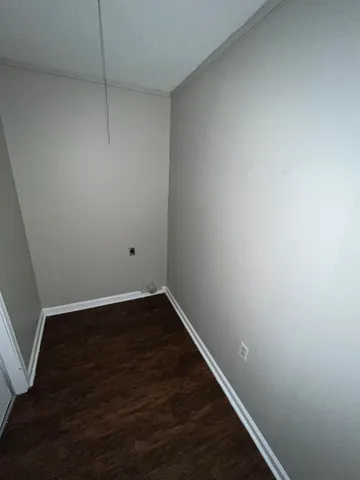 a view of small space with wooden floor